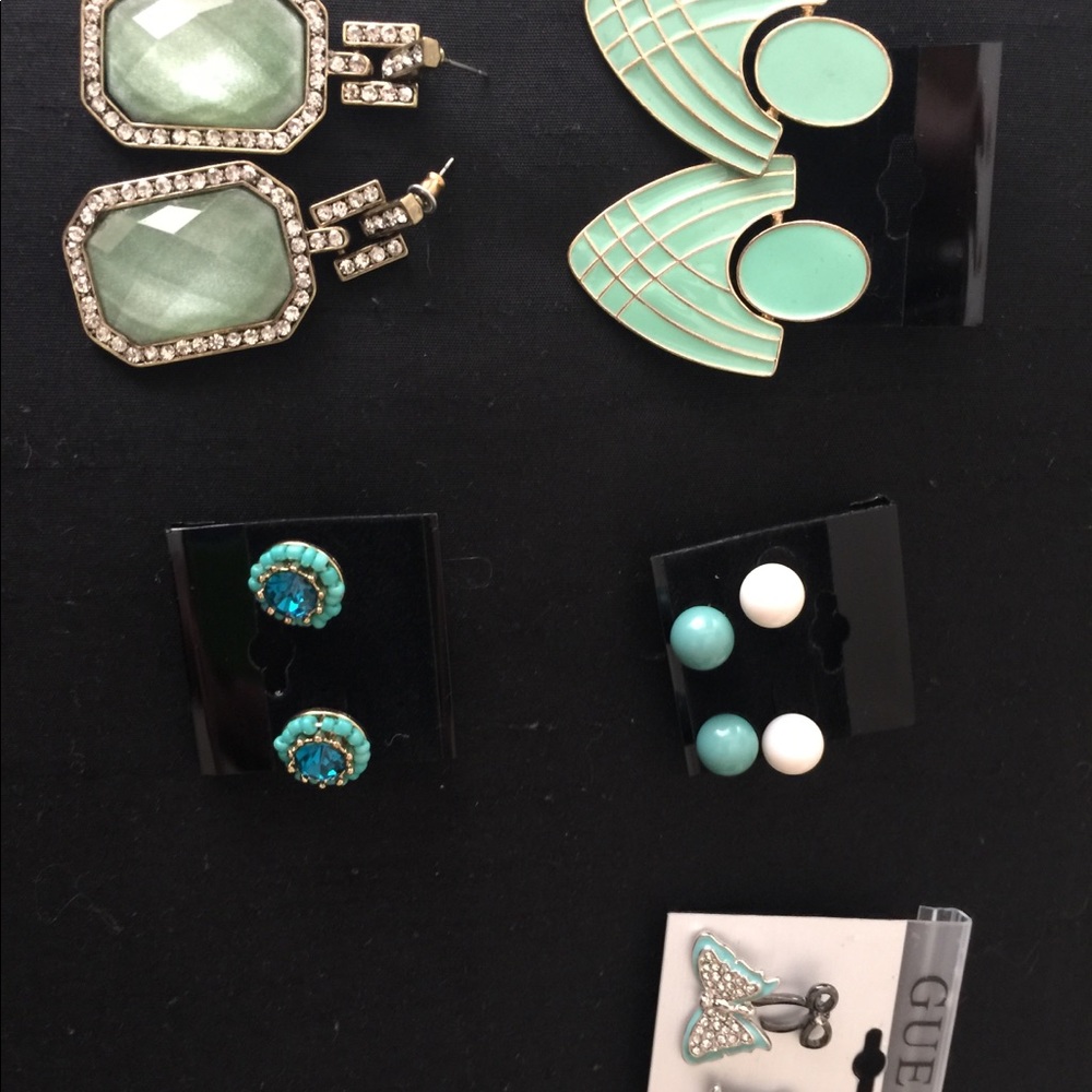 Lot of turquoise colored earrings.
